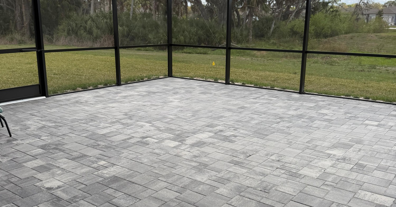A wide brick paver driveway and front yard highlighting paver patio installation cost in Hillsborough County. option