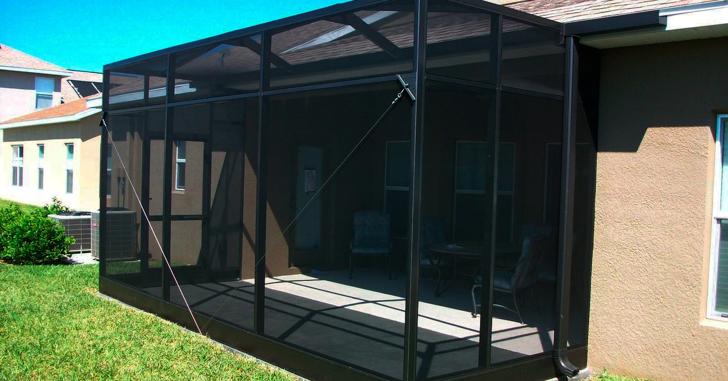 A black patio screen structure, often built alongside projects evaluating carport installation cost in florida
