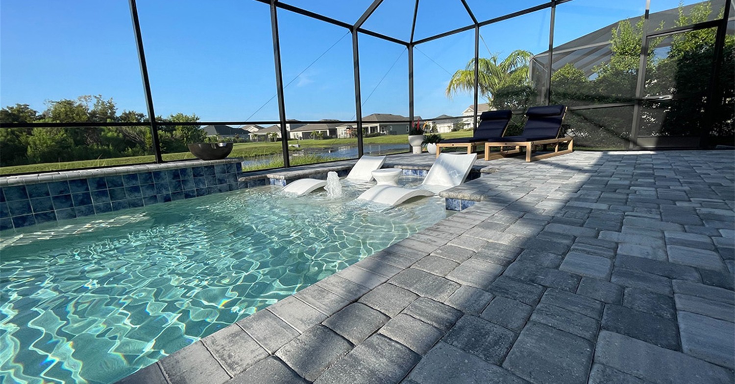 A modern pool deck featuring a stylish grey paver color for your Tampa patio
